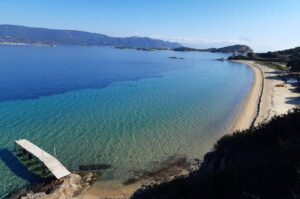 Sandy beach with turquoise waters at Megali Ammos beach, Ammouliani