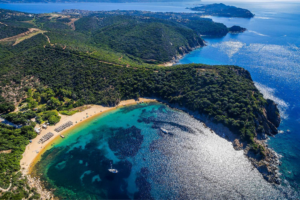 Overview of the beach of Karagastia showing turquoise waters & green landscape