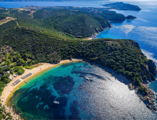 Overview of the beach of Karagastia showing turquoise waters & green landscape